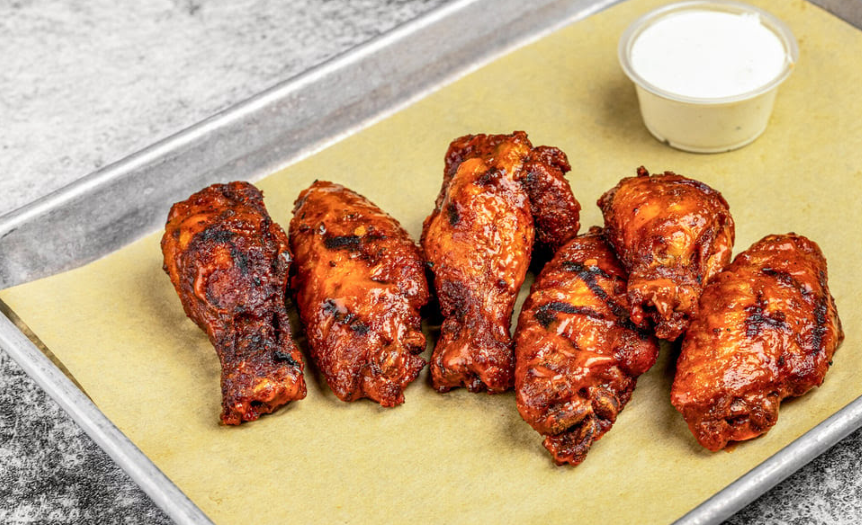 Wings from The Den by FoxGardin inside Sun King Carmel in Midtown
