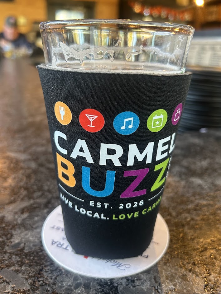 A pint in a CarmelBuzz koozie