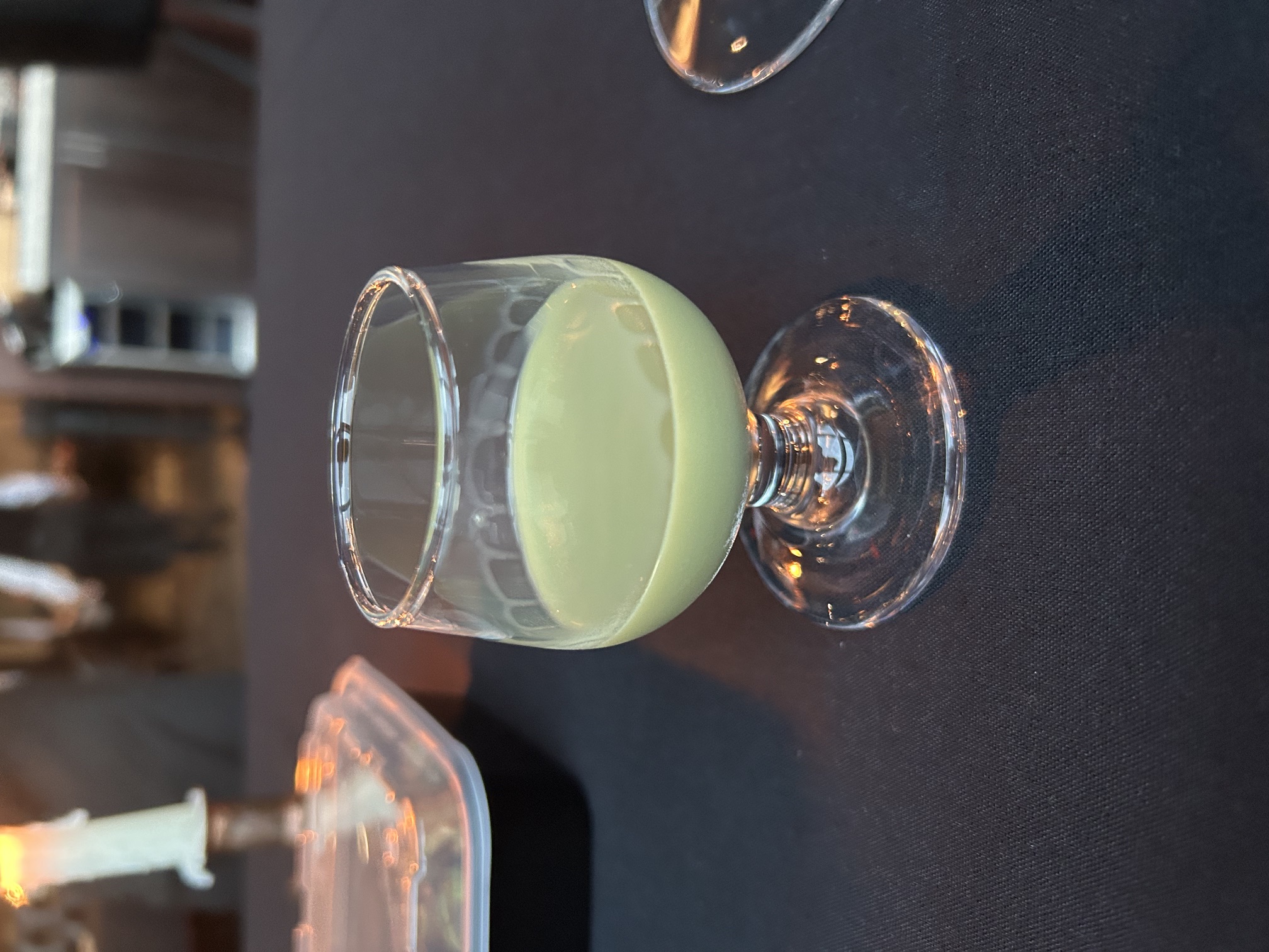 After-dinner pistachio liqueur shot at Charred Steakhouse, Carmel Indiana
