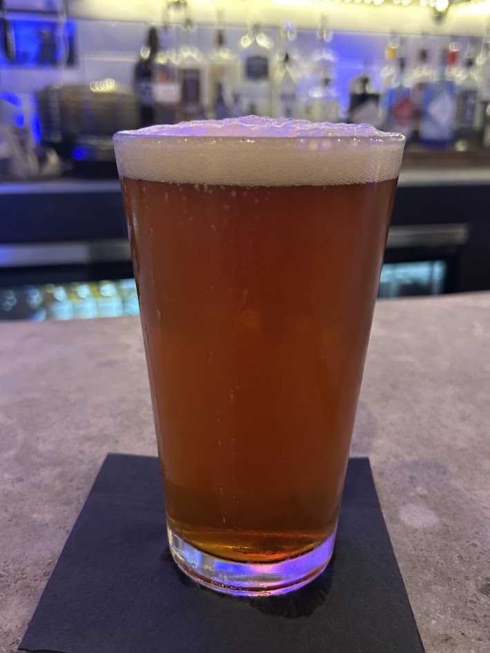 A pint of Fork + Ale&rsquo;s own Hopping Hound IPA in Midtown Carmel