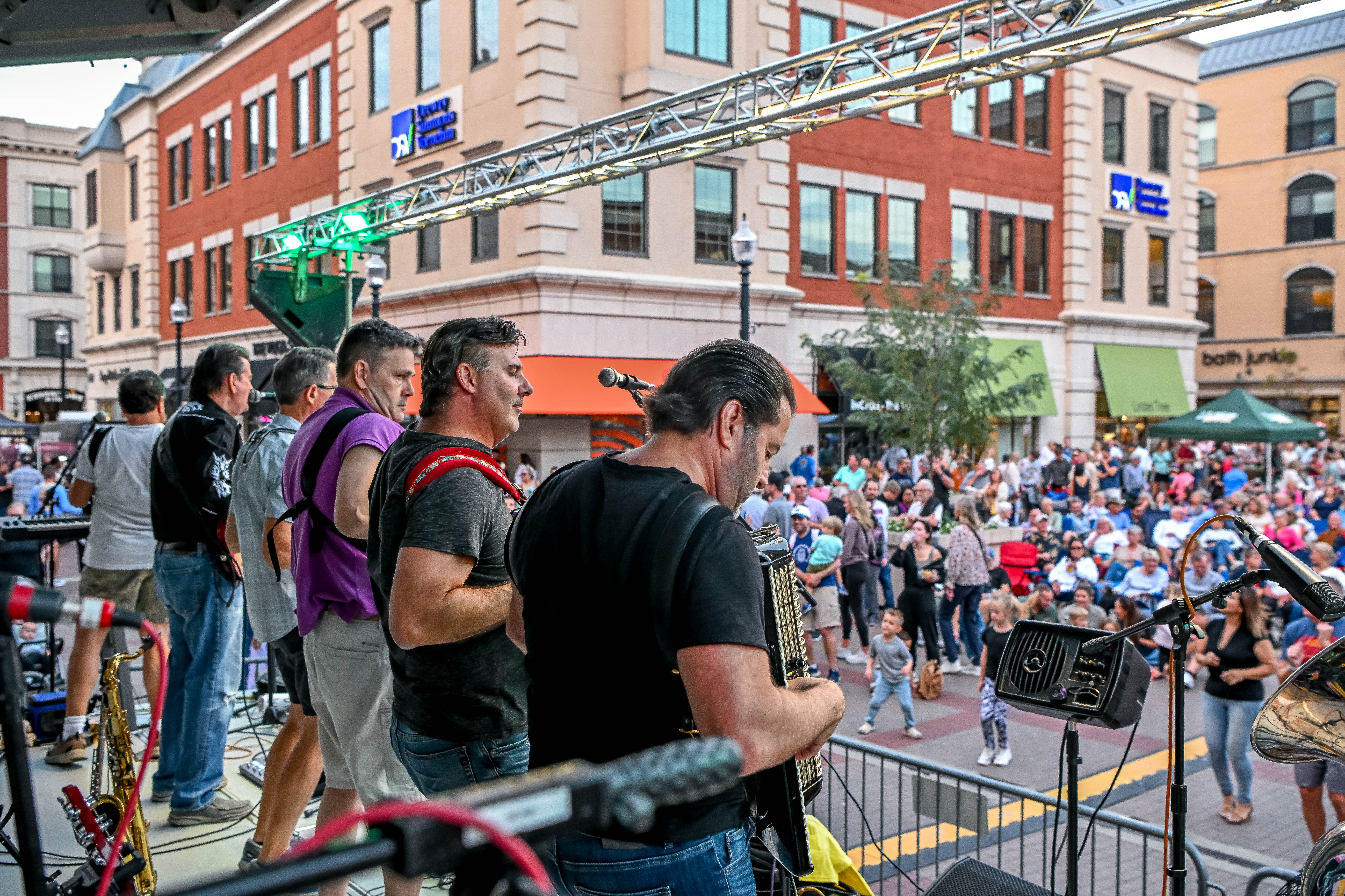 Crowds enjoying food, drink, and polka music at Carmel Oktoberfest at Carmel City Center