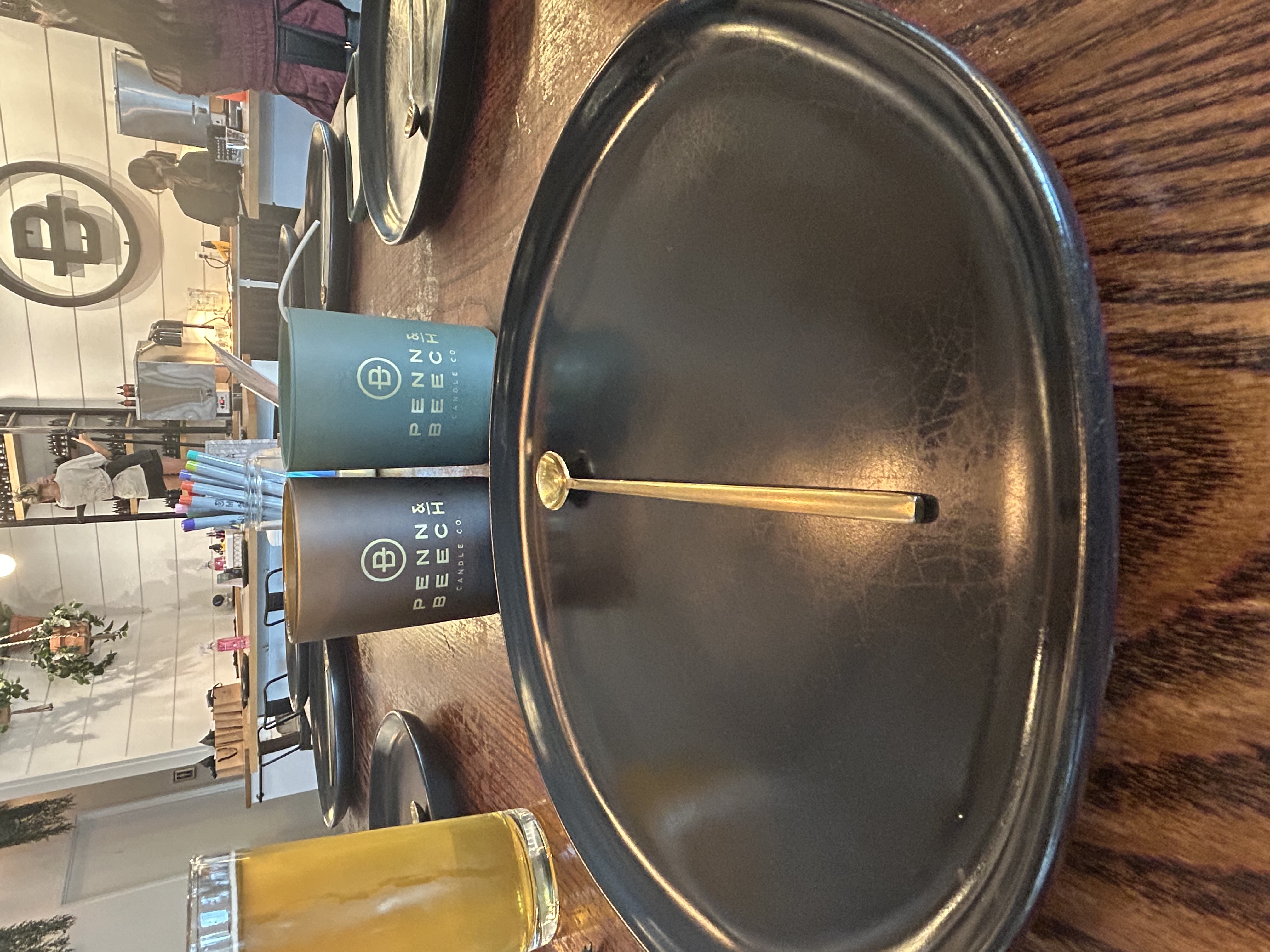 Two Penn & Beech candle vessels and a beer on a pouring table
