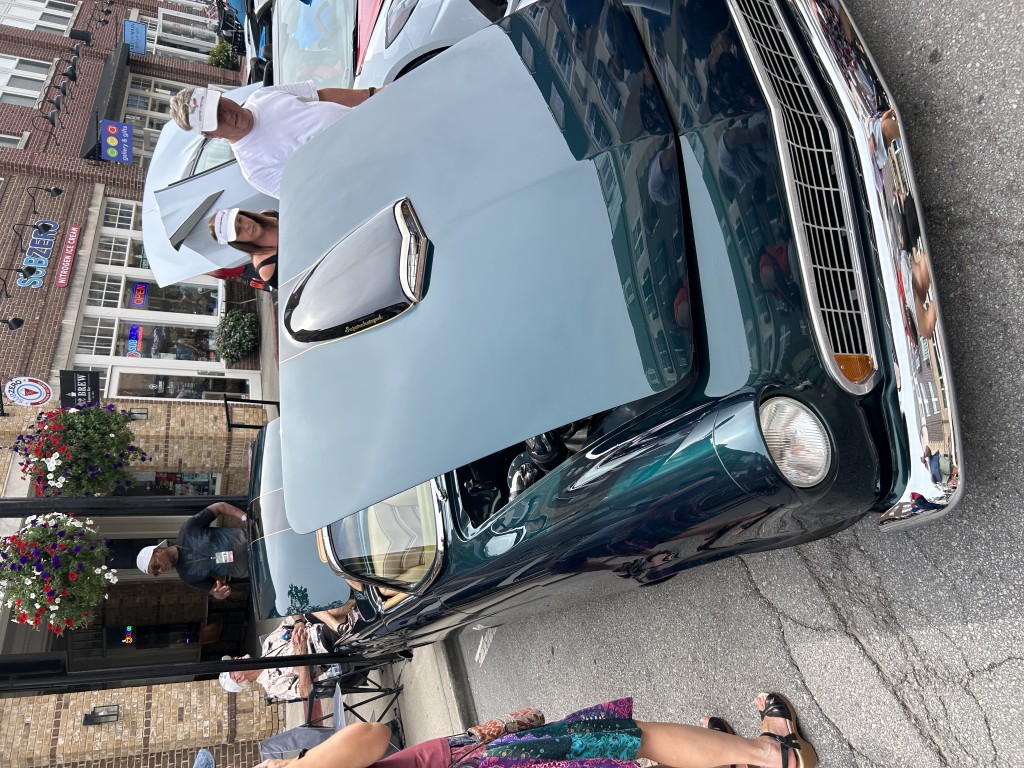 A vintage car on display along the street at Artomobilia in Carmel, Indiana