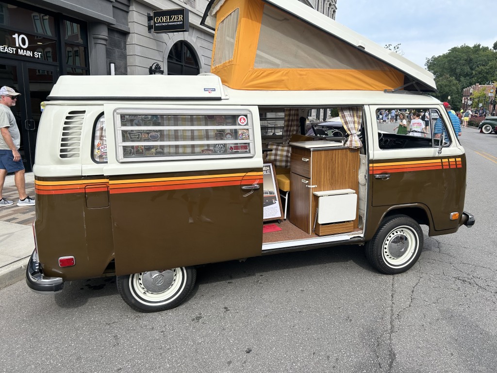 A classic Volkswagen bus drawing a crowd at Artomobilia in Carmel, Indiana